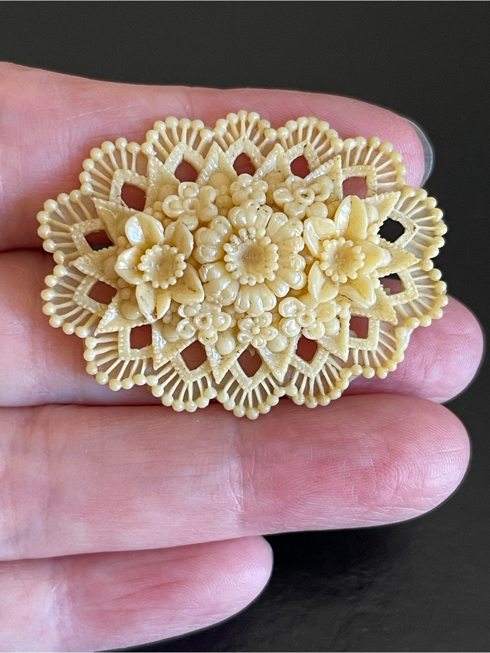 Antique Occupied Japan carved celluloid flower Brooch.